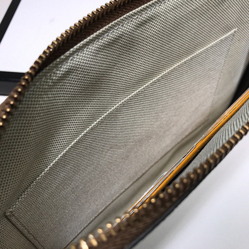 G*u*i clutch bag